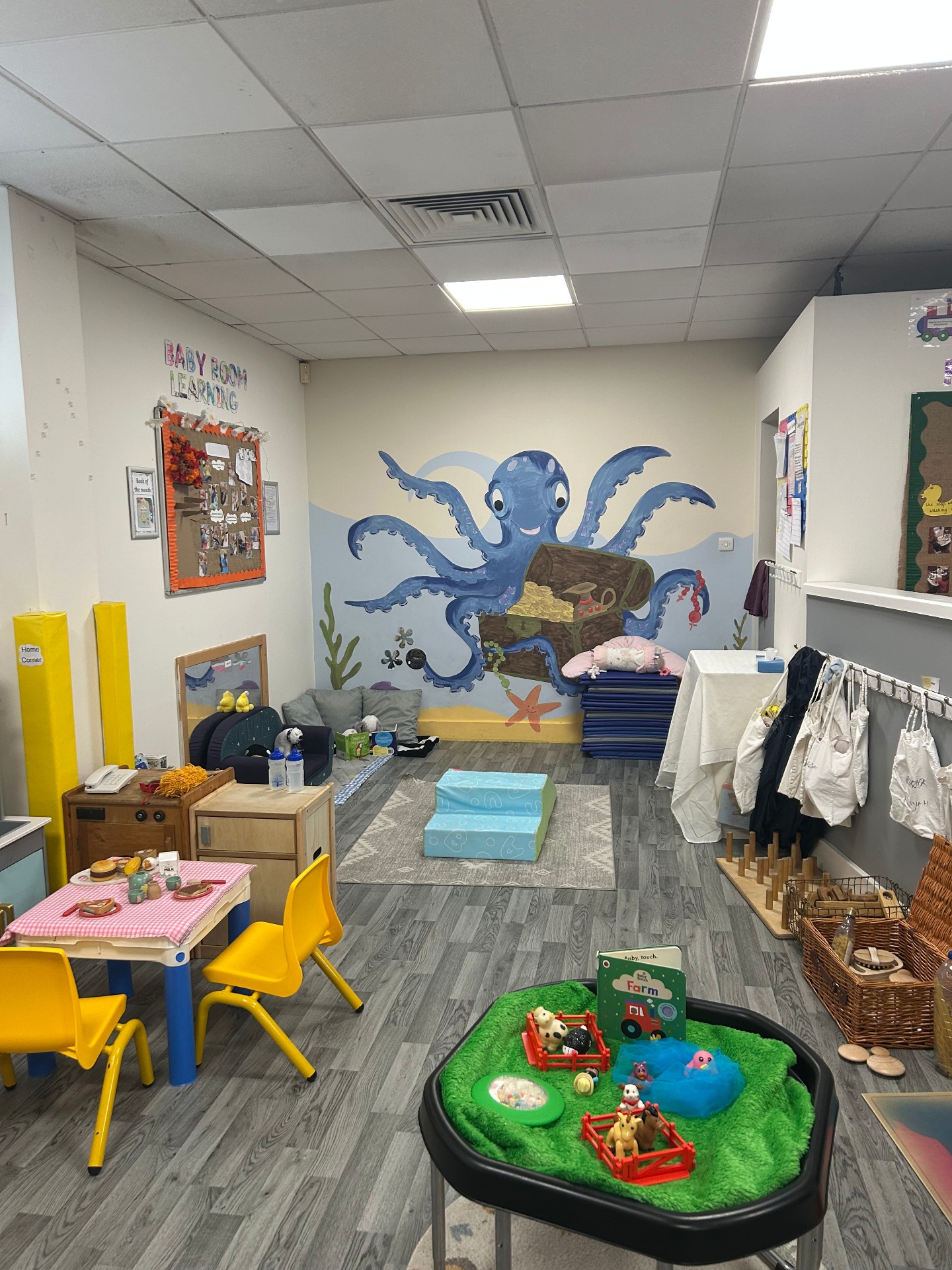 Our calm baby room with soft furnishings and sensory play areas